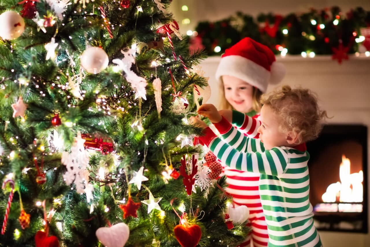 Kids decorating Christmas tree