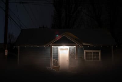 snowy house at night