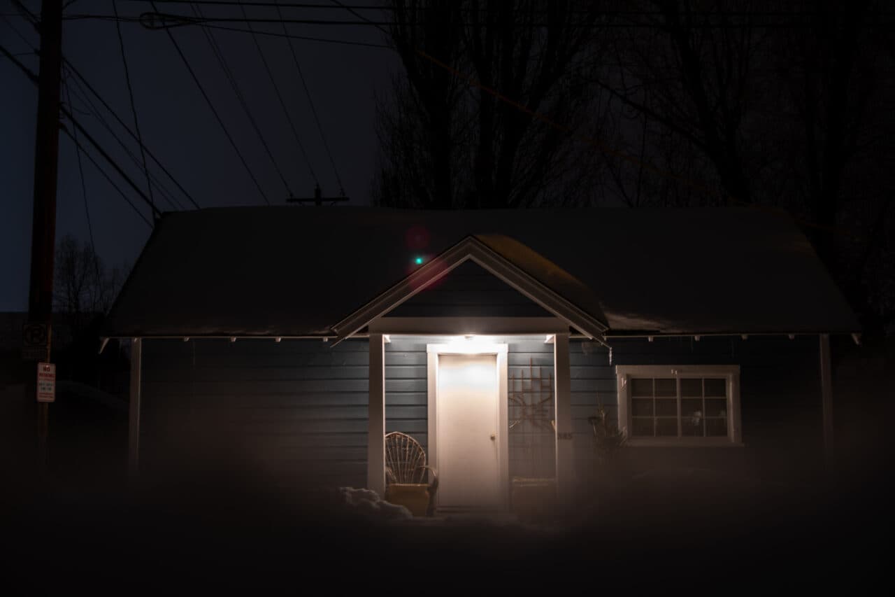 snowy house at night